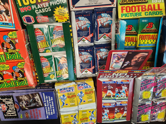 Lot of 100 NFL Football Cards in Unopened Packs.